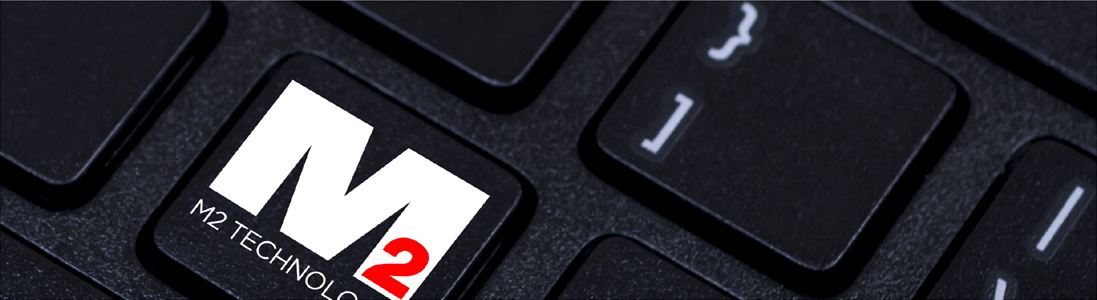 close up of keyboard with M2 logo